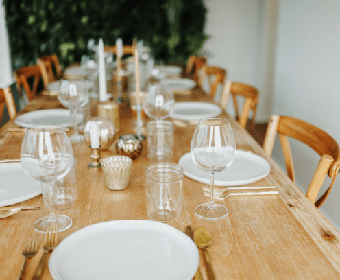 Table place setting with wine glasses.