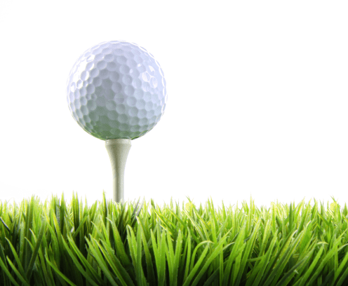 Golf ball with tee in the grass on white