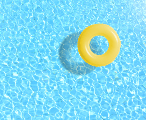 yellow swimming pool ring float in blue water. concept color summer.
