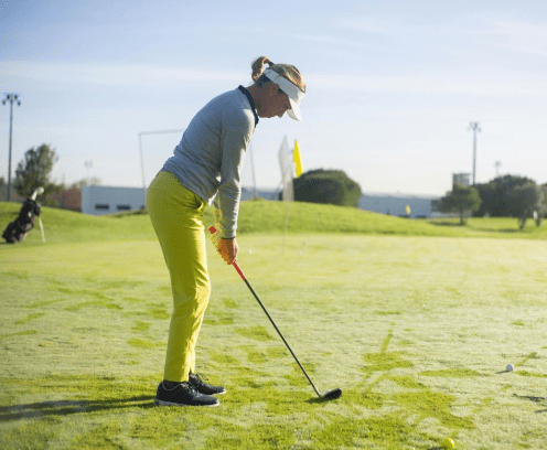 Female Golfer on Putting Green