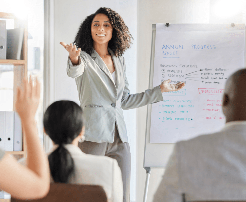 Presentation, question and business black woman in a workshop, conference or meeting for company strategy talking data. Leader, audience and corporate professional female teaching at a seminar.