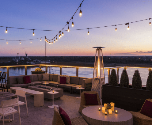 Outdoor patio cape water view at sunset.