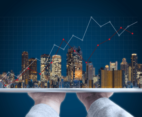 real-estate-business-investment-with-hands-holding-tablet