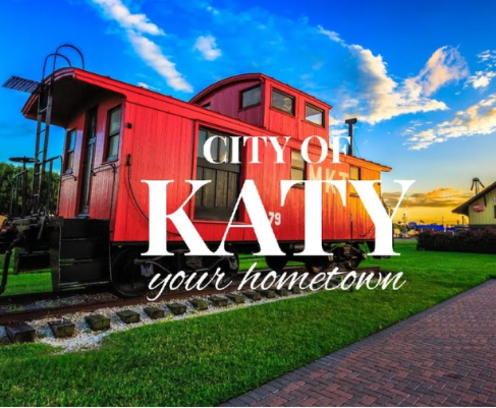 Red train caboose with the words City of Katy, Your Hometown