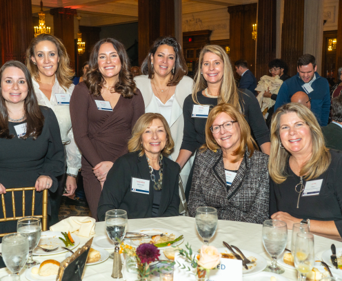 People gathered in Philadelphia's Crystal Tea Room around fancy lunch tables