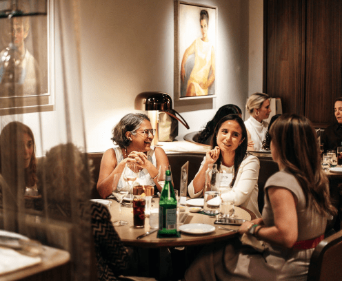 Professional woman at a networking dinner