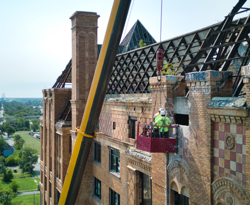 Construction crew working on Lee Plaza building