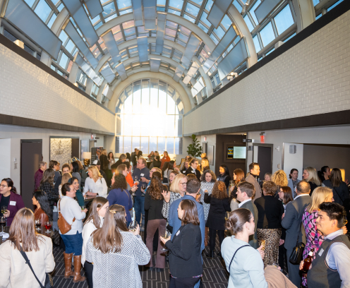 group of people standing in sunlight