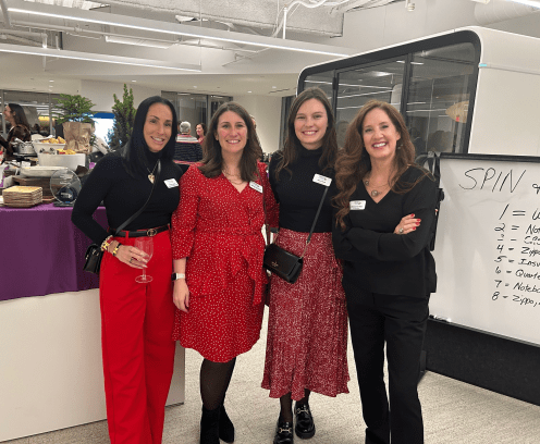 Four women at a holiday party.