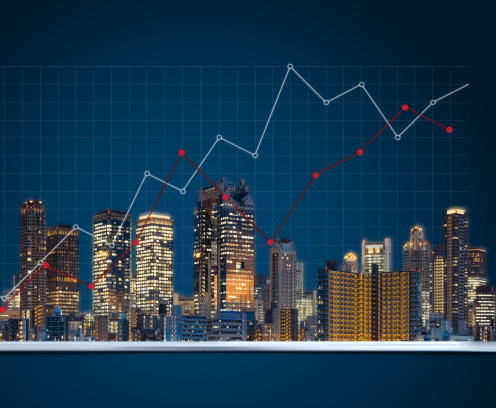 real estate commercial buildings beaming out of a tablet with superimposed trendlines