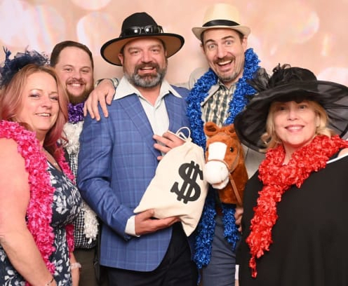 Guests at CREW Seattle Signature Soiree wearing fun hats