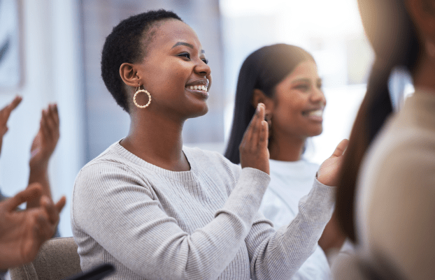 black-woman clapping and smiling