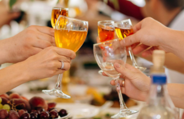 group-of-hands-holding-drinks-cheers
