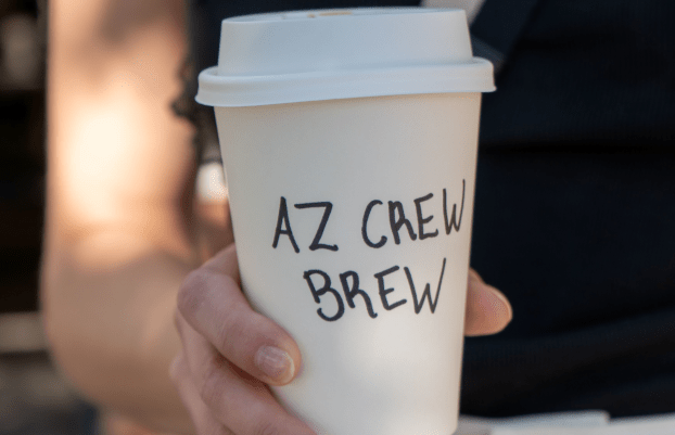 AZCREW Brew written on a coffee cup