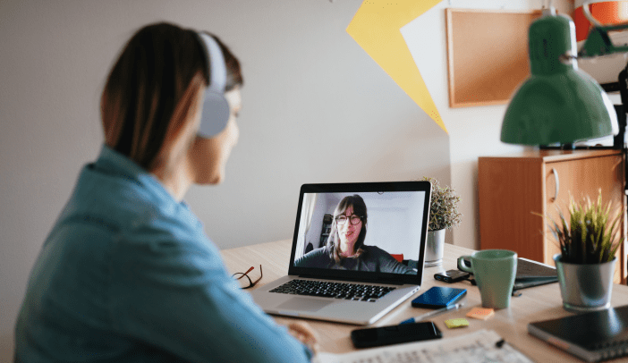Woman teleconferencing with sister on laptop
