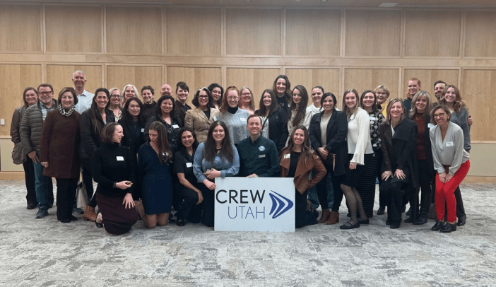 Group photo holding a CREW Utah sign