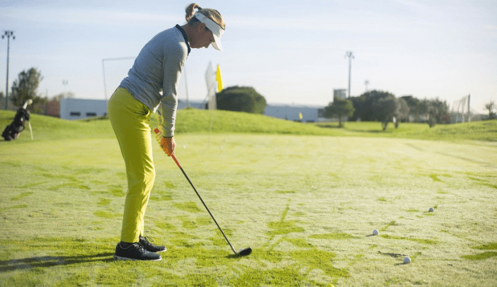 Female Golfer on Putting Green
