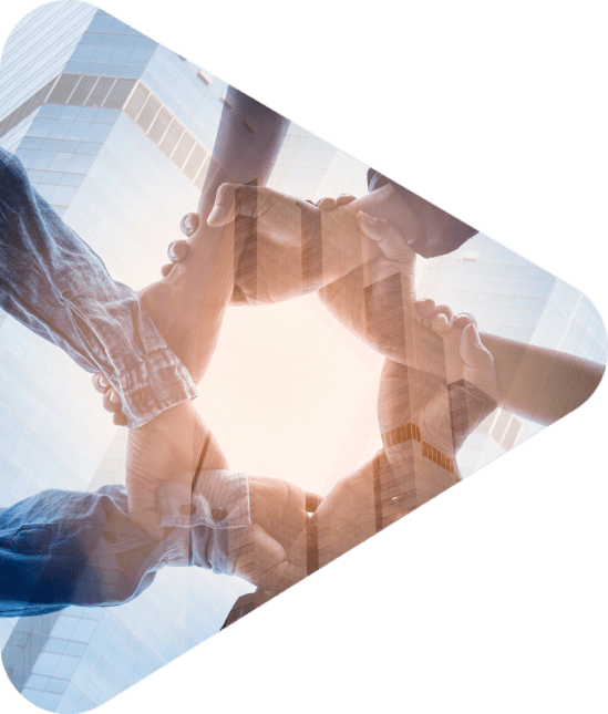 hands joined together in unity with skyscrapers in the background