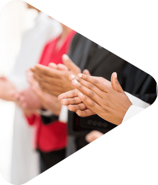 group of businesspeople clapping hands during meeting presentation