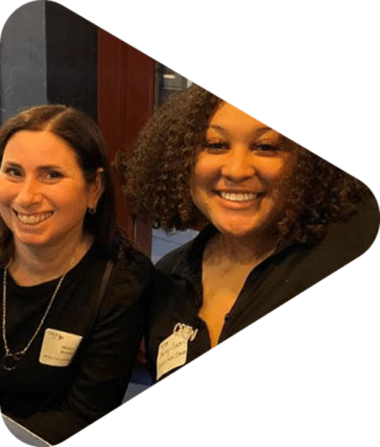Two Smiling women at a networking event