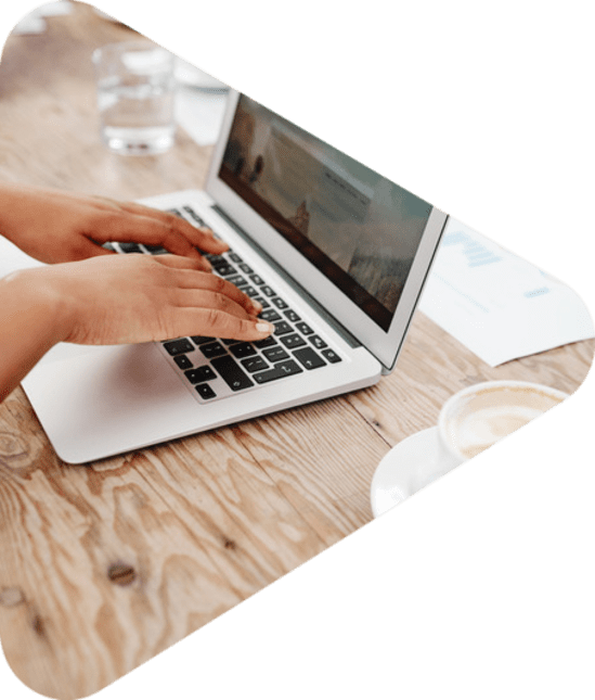 hands typing on a laptop