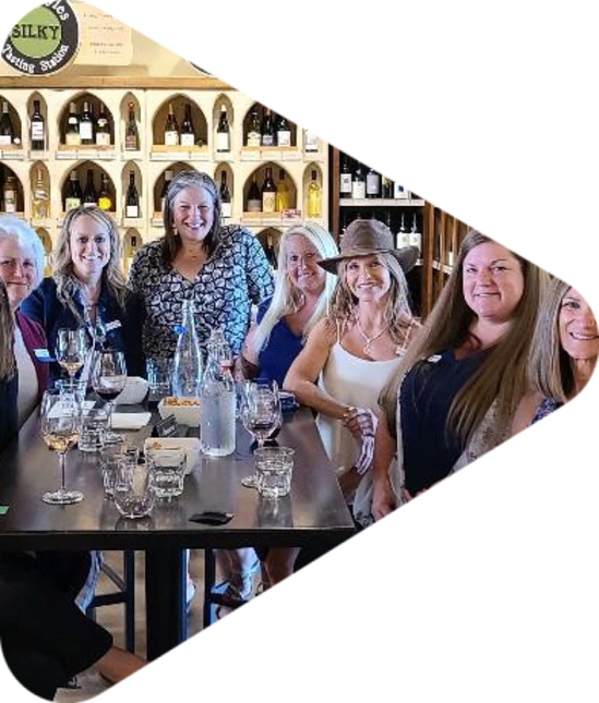 Women around a wine tasting table