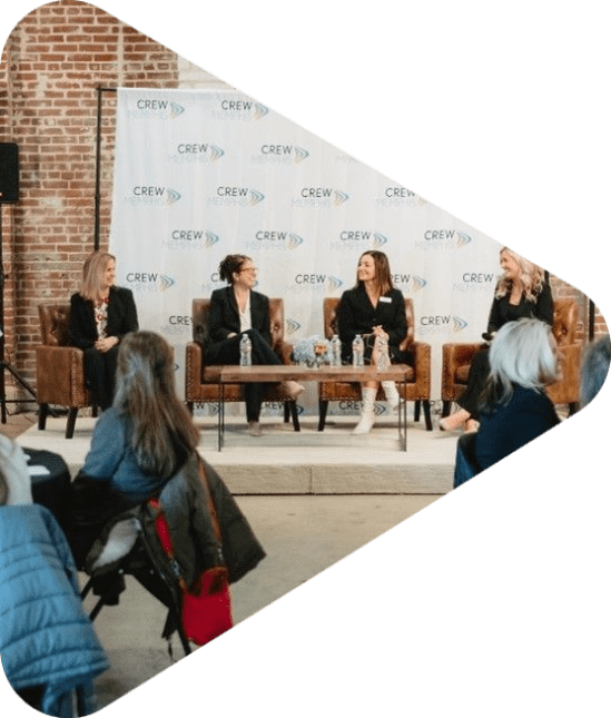Women on stage at a panel