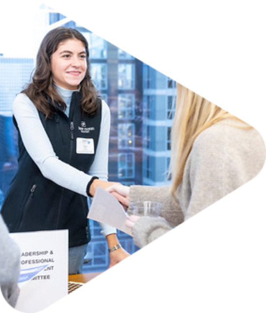 CREW member shaking hands with blonde female
