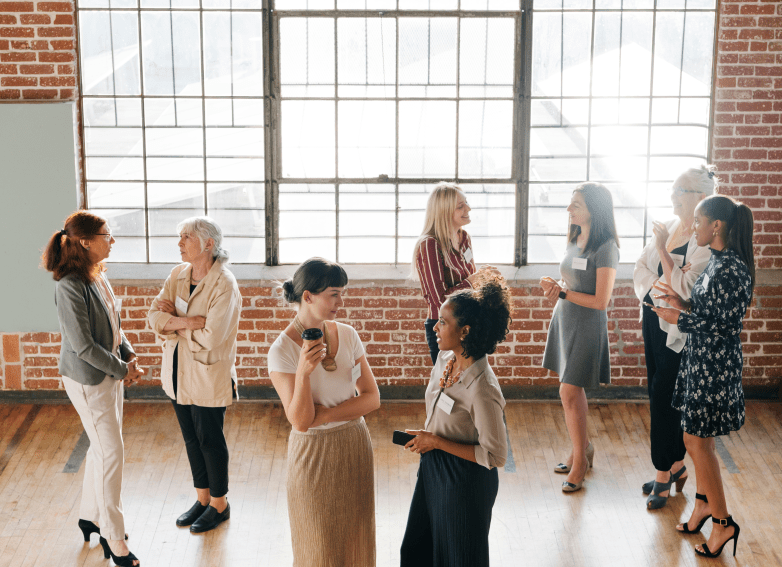 women-in-front-brick-wall-with-windows