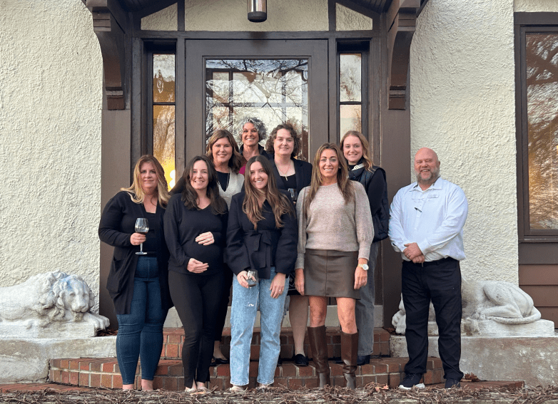 People outside in front of a door