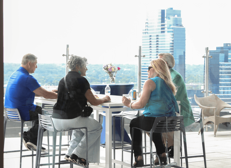People at a table in a rooftop bar