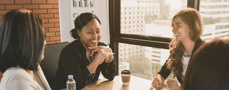 Happy diverse businesswoman leaders in meeting room