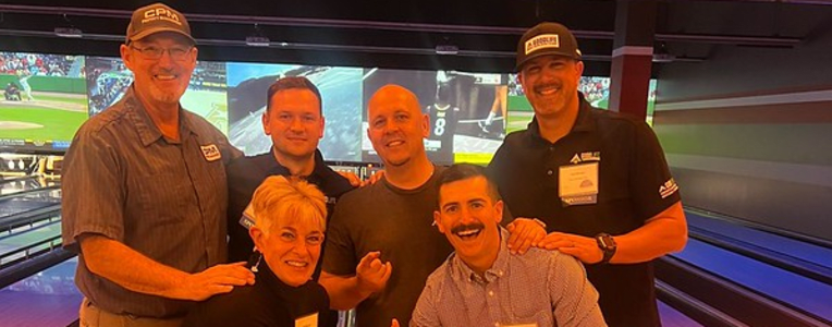 group of people in bowling alley