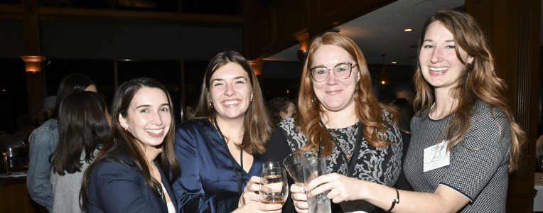 four ladies at a cocktail event