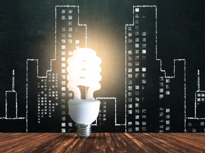 Cityscape chalk drawing with lightbulb
