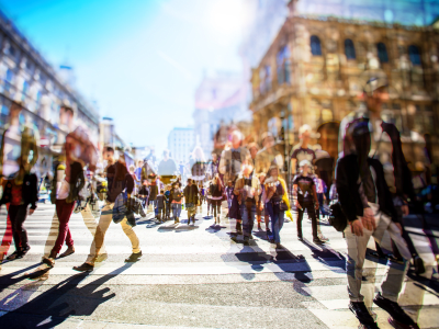 blurred photo of a crowd of people walking on a busy city street