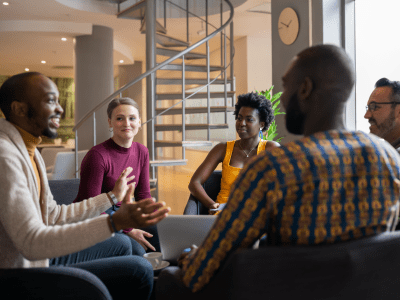 Group of diverse south african business people having a candid meeting in a modern work space