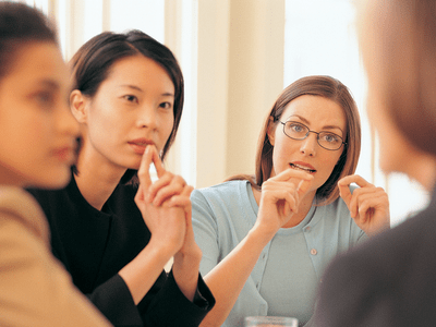 diverse women discussion speaker foreground