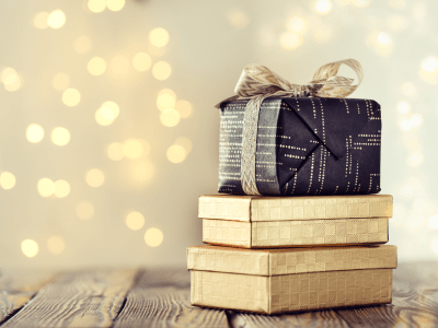 Composed stack of wrapped and decorated boxes with Christmas presents.