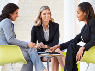 Three businesswomen sitting and meeting