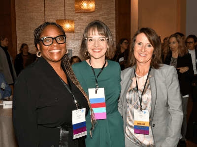 Three ladies at a cocktail event