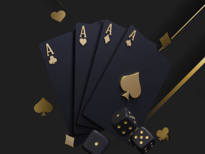 four gold ace cards and three dice on black background