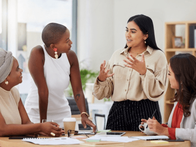 women-talking-around-table