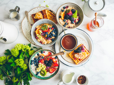 breakfast-oatmeal-with-fruit-waffles-coffee-cream-fancy