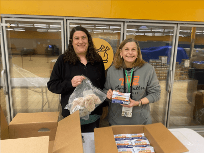 Two women holding food