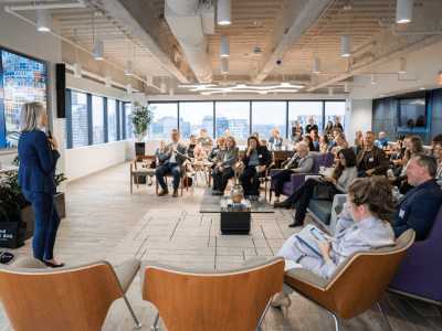 Room of people watching a presentation