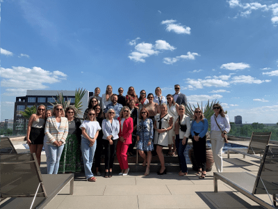 Group of people posing on a rooftop