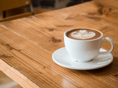 full-coffee-cup-on-wooden-table
