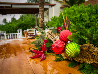Christmas centerpiece with ornaments on a wooden table