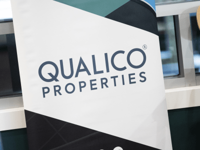 Qualico Properties logo on a Stand up banner